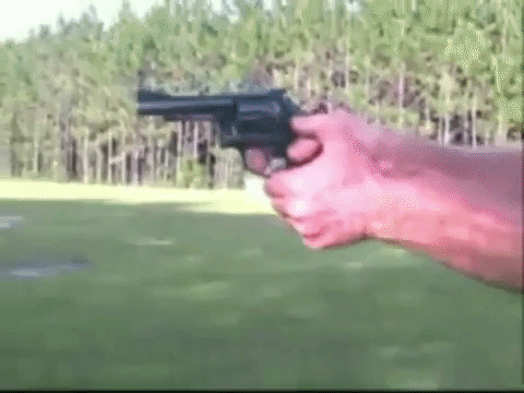 A competition shooter showing a quick revolver reload.