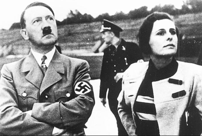 Adolph Hitler and Leni Riefenstahl review staging for filming a Rally