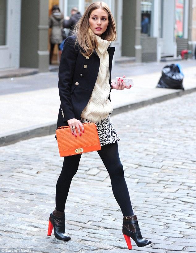 Olivia Palermo wearing animal print skirt (fashion 2k18 but also edgy and a sure choice) with black not see-through tights (again fashion 2k18, edgy and a sure choice)