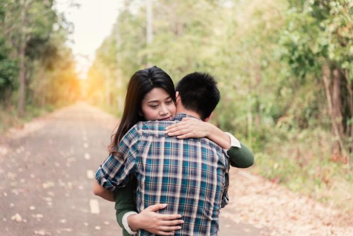 This is a friendly hug, but she may have feelings for him too