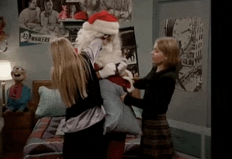 A full house Christmas, (trying to help joey into a Santa suit)