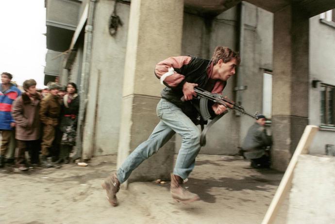 Young Romanian resistance fighter on pursuit of fleeing communist secret police members.