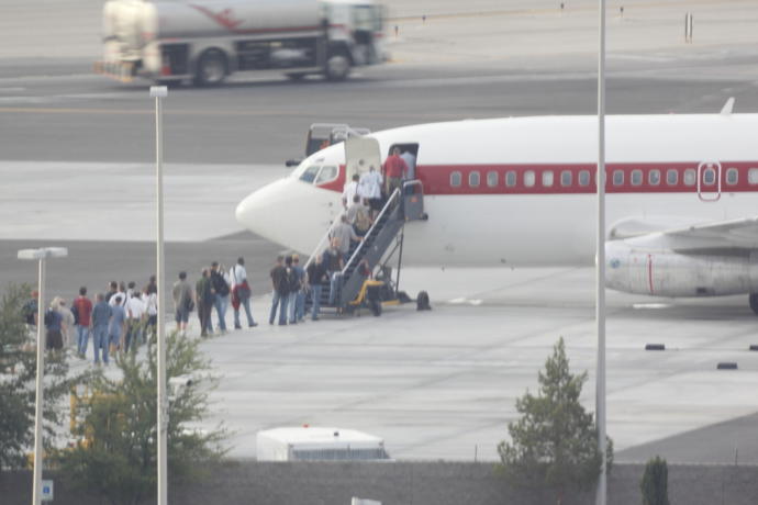 Passengers boarding a JANET plane.