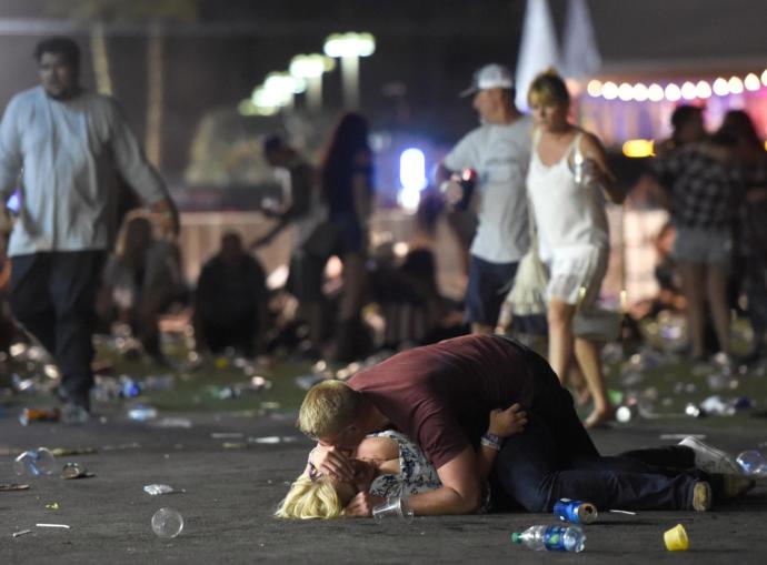 Man trying to protect a woman with his body in a mass shooting!