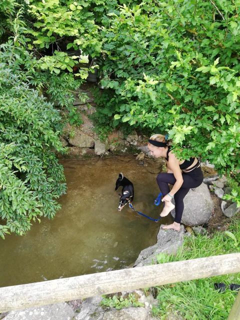 Marisa taking a dip with Aro our dog