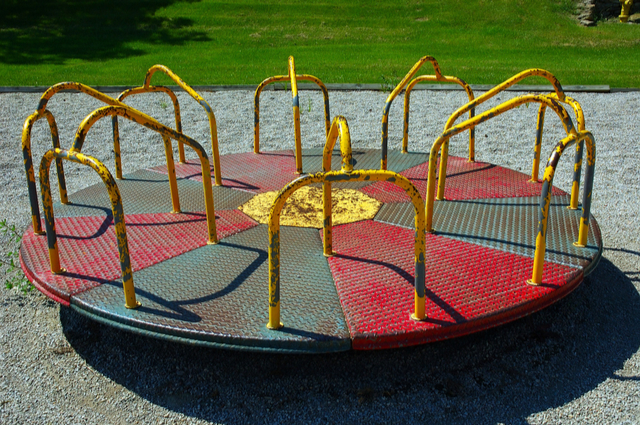 Metal Merry-Go-Round - notice the gravel