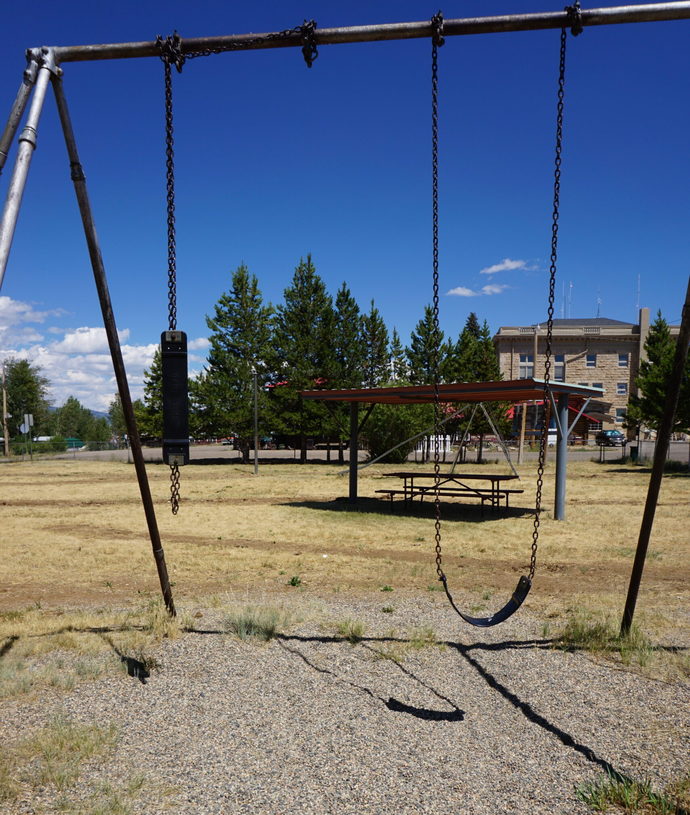 Universal school swingset - ours had a rubber pad over asphalt.