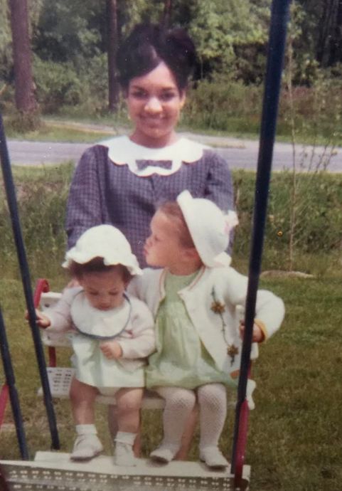 The author and her sister Suzette being swung by their mom in 1968. (*)