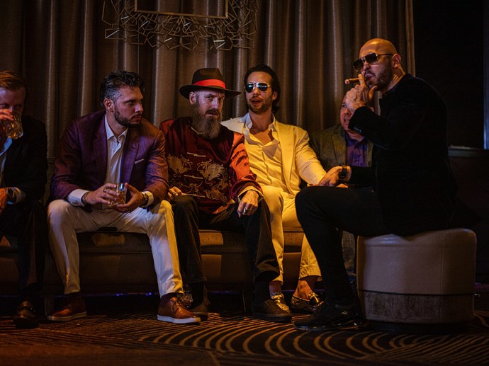 An image of Andrew Tate and his associates in "The War Room"
