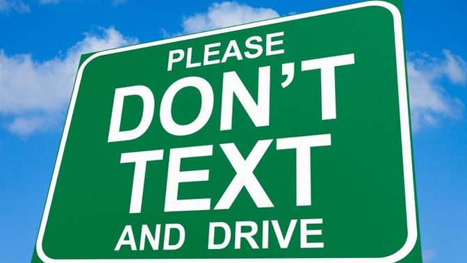 The dangers of using a mobile phone while driving.