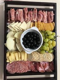 A variety of foods on a charcuterie board