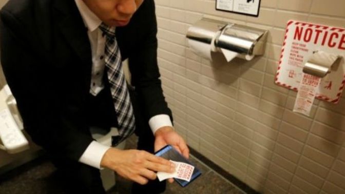 My husband spends hour in bathroom what is he doing?