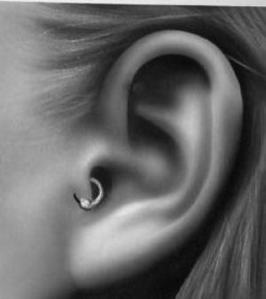 Guys, do you like tragus piercings on girls?