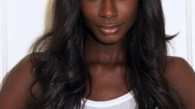 Why are black women considered unattractive by society's standards?