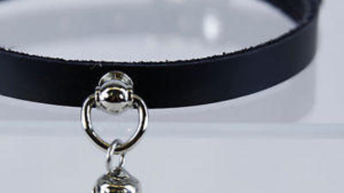 Why does this girl in my class wear a collar with a bell on it?