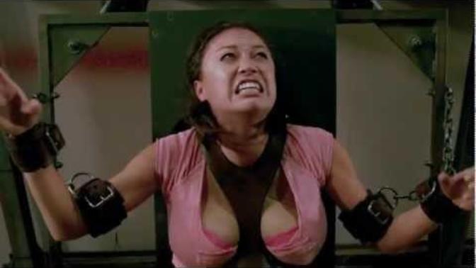 In this Saw 3D movie public execution game scene, who would you have rooted for to survive, the woman suspended above the saw or both of the men?