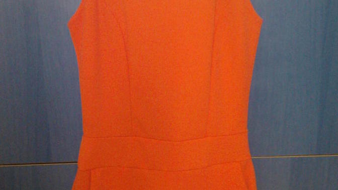 What colour is the dress? Pink or Orange?