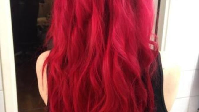I have dark brown hair right now and it looks so boring to me since i've had it so long. Would bright red like the picture look good?