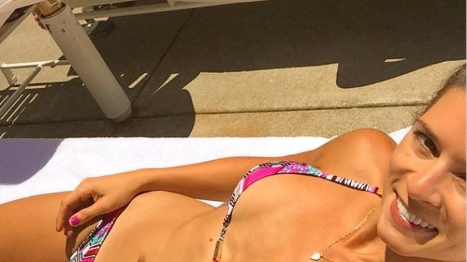 Is it just me or is this bikini barely covering her boobs?