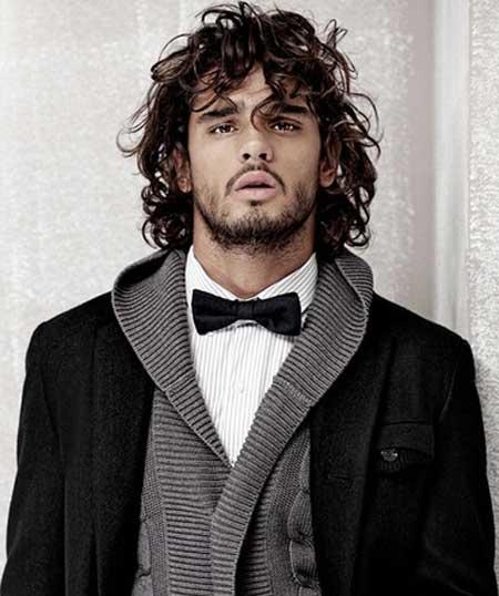 Do girls fancy Harry Styles for his hair, are long curls attractive in a guy?