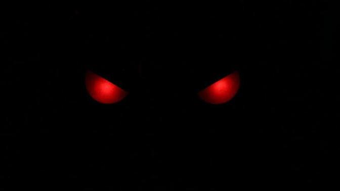 You walk outside at night and see a pair of glowing red eyes peering at you from a bush. What do you do?