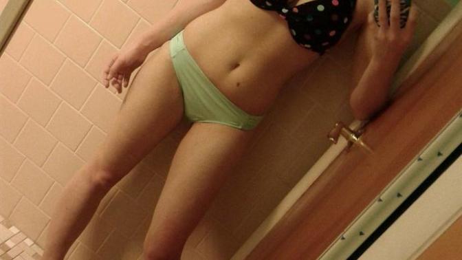 Is a small stomach pooch on a very petite but curvy woman unattractive in a bikini at the beach?