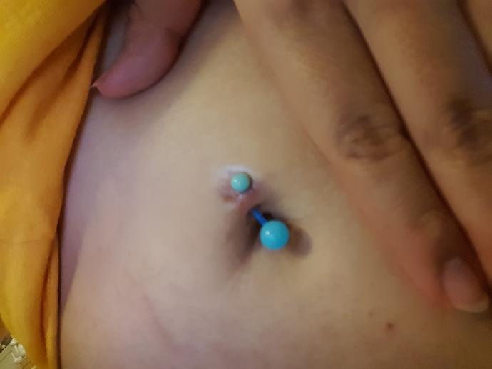 Is my navel piercing rejecting? Or is it still infected?