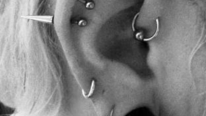 Age old fight between piercings and tattoos?