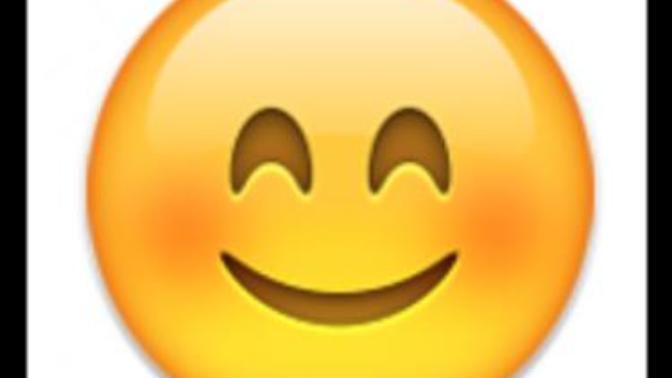 Why would a girl using a blushing emoticon in this sentence?