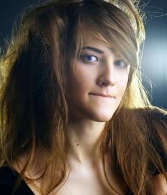 What does it mean when a girl swallows their lips inside their mouth (hiding their lips or pursing their lips) when looking to a boy?