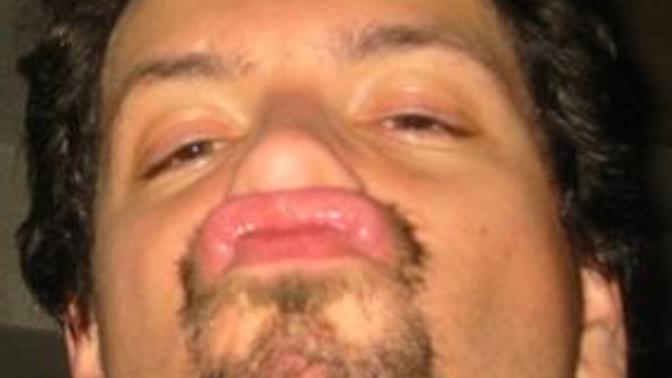 When a guy rolls his upper lip up to his nose, does that mean there's a scent of another woman on that man's lip?