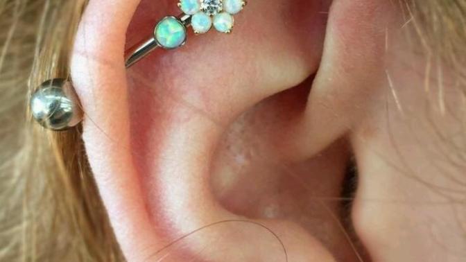 What do guys think about industrial bar piercing on girls? I want a pretty one to make it more feminine. Thoughts?