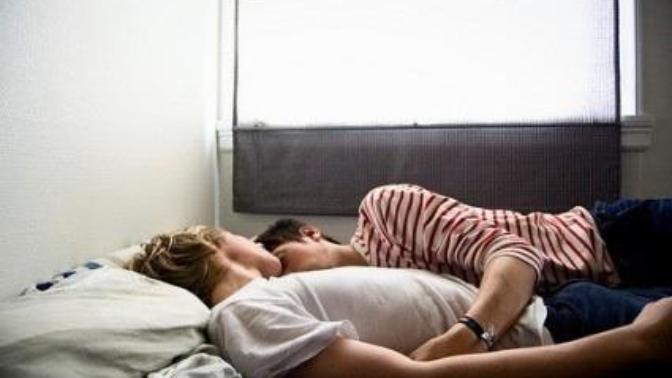 Is it gay if two guys sleep in the same bed together?