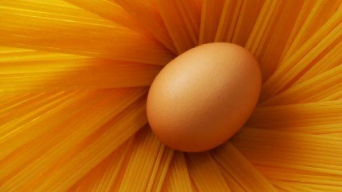 Why does boiling water make eggs hard but pasta soft?