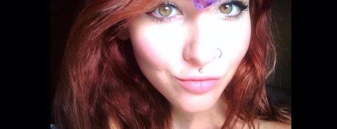 Does she has green or hazel eyes?