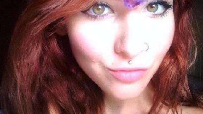 Does she has green or hazel eyes?