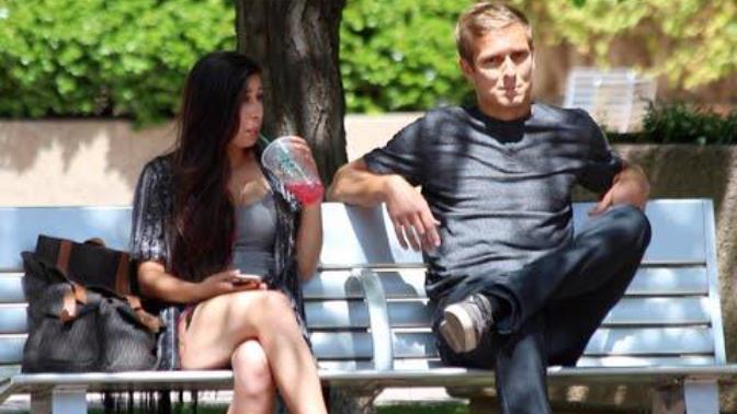 How do you tell if the girl in the video is just shy or not interested?