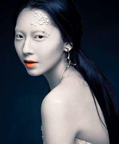 Is it logical to conclude that, if mermaids exist, they'd be very pale, almost blueish in color?