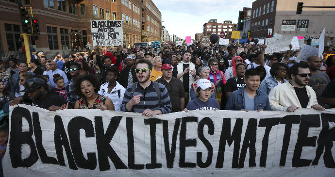 Does resolution of the racially motivated police shooting issue require action by the media or the black community?