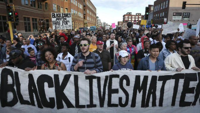 Does resolution of the racially motivated police shooting issue require action by the media or the black community?