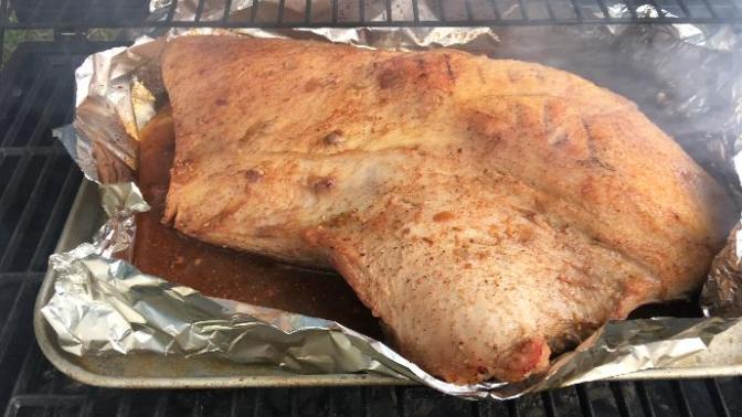 Who's hungry? I have this 13.75 lb. beef brisket on the grill smoking it with a mix of hickory , cherry and pecan wood chips. ?