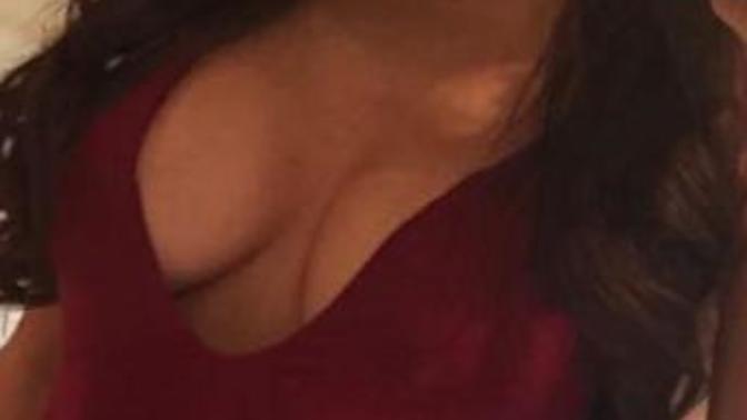 Do these breasts look fake (clothed image)?