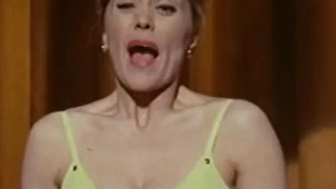 My girl complains that men eye-fondle her big breasts, but why do I occasionally catch her smiling as if she enjoys it?