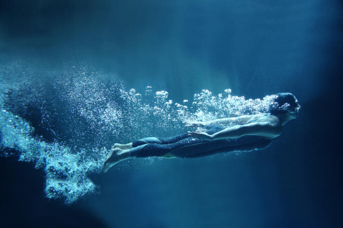 Do you swim with your head above the water or do you stay submerged as long as you can?
