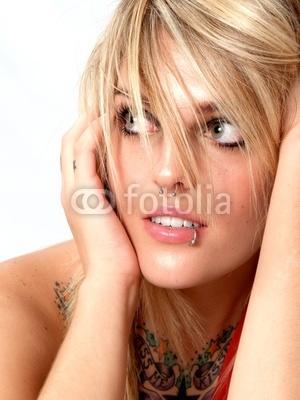 Lip piercing on girls attractive or ugly? Just one lip ring at the side of the bottom lip?