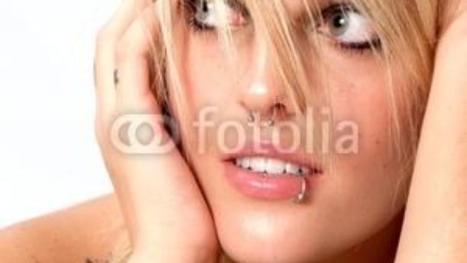 Lip piercing on girls attractive or ugly? Just one lip ring at the side of the bottom lip?