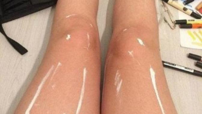 GaGers, do this girl's legs look wet and shiny to you? Or do they just look like they have some streaks of white paint on them?