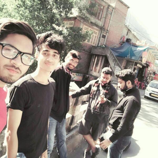 I am always been stared by girls at college but being an introvert I feel uncomfortable....(I am second guy from left )?