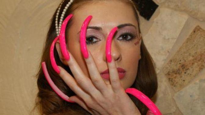 Why do women feel they need to get their nails done?