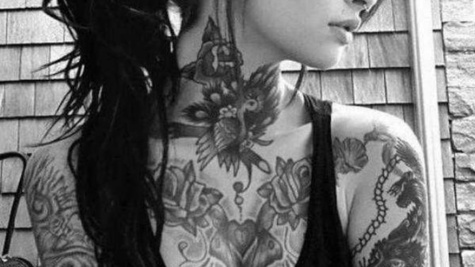 Guys, would you date a girl with lots of tattoos even on her face?